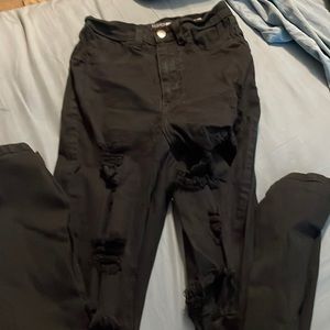 Black holy skinny jeans